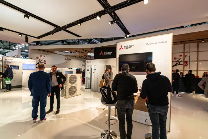 Mitsubishi Electric Business Partner corner with outdoor unit and cabinets