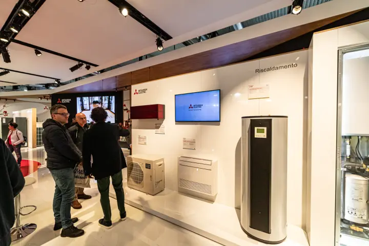 Mitsubishi Electric heating wall with heat pump water heater and red split unit