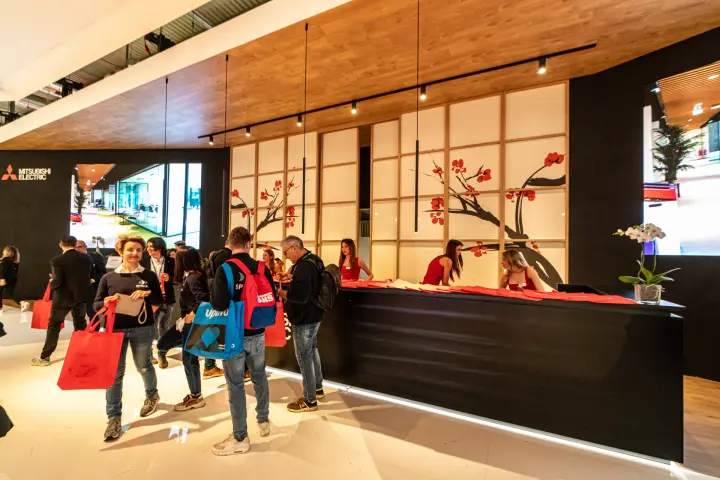 Mitsubishi Electric reception counter with shoji panels and red visitor bags