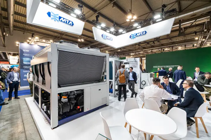 MTA stand with large air-cooled chiller under hanging logo signs at MCE 2024