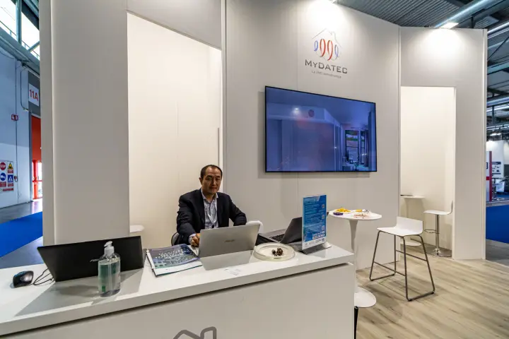 Mydatec reception desk with La VMC termodinamica logo at MCE 2024