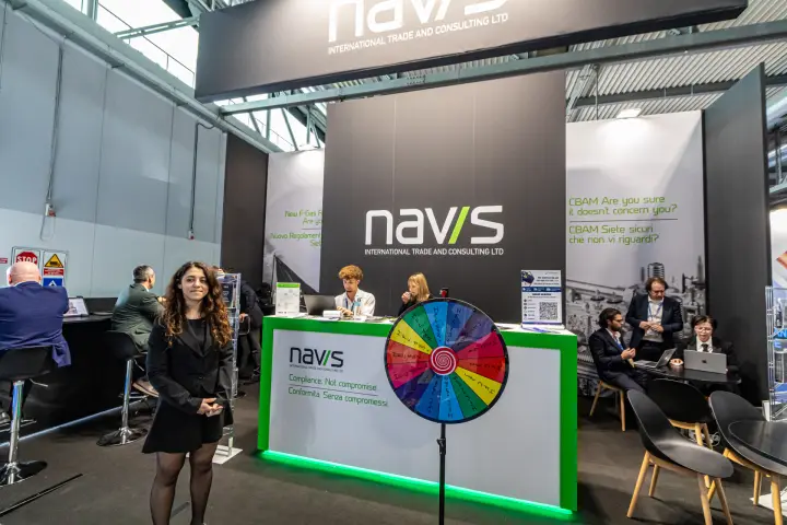 Navis compliance consulting stand with prize wheel and CBAM graphics at MCE 2024