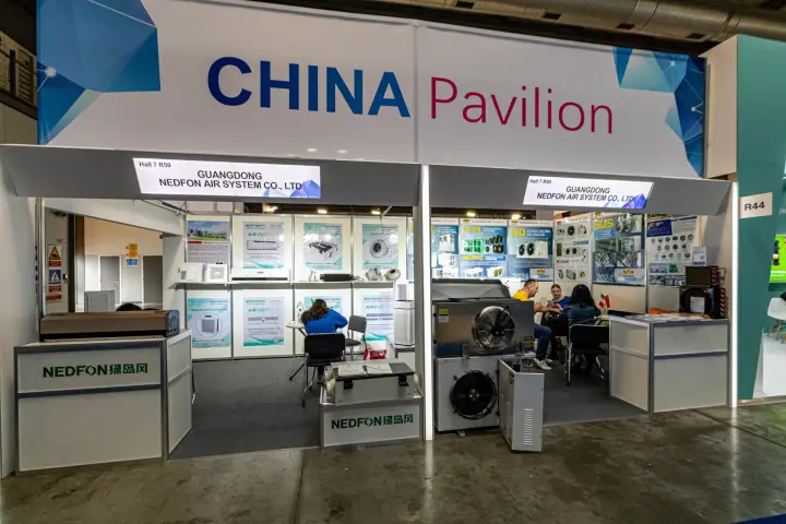 Nedfon booths under the China Pavilion sign with air curtains and air coolers