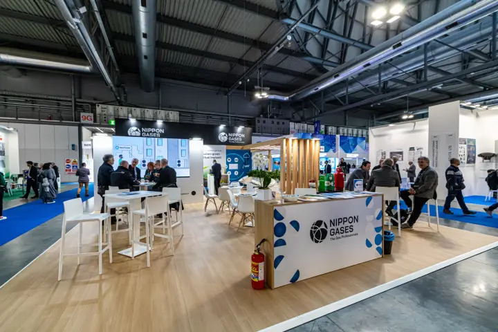 Nippon Gases stand with wood floor, heat pump video wall and meeting tables