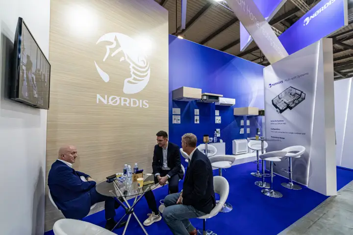 Nordis stand with wood-grain logo wall and multi-split systems panel