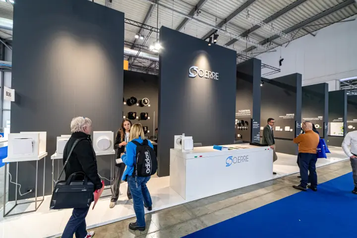 O.Erre stand with charcoal totems and domestic extractor fan displays at MCE 2024