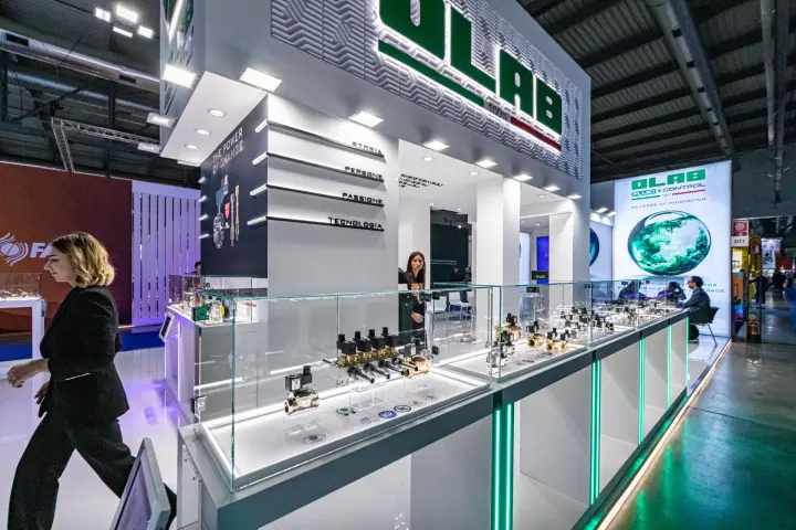 Olab solenoid valves in lit glass showcases under 'THE POWER OF CHANGE'