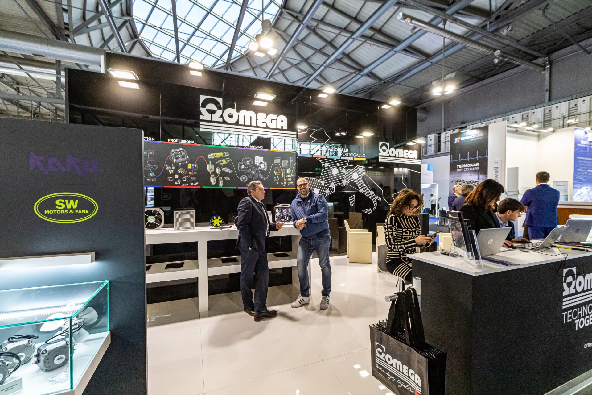 Omega stand with SW Motors & Fans display and component wall at MCE 2024