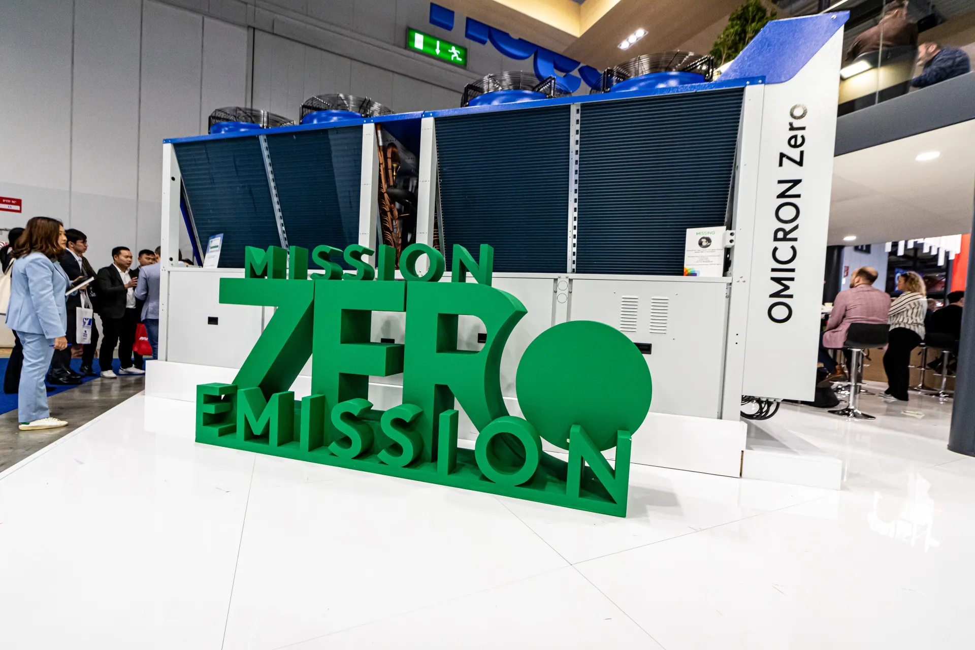 OMICRON Zero unit behind green Mission Zero Emission lettering at MCE 2024