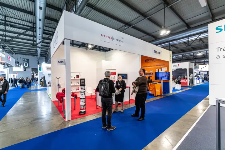 Pfeiffer Vacuum stand U05 beside the orange Elitech booth at MCE 2024