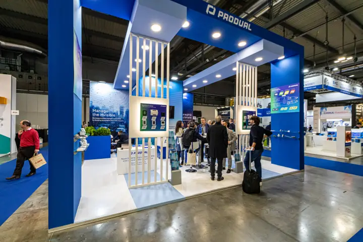 Produal stand with blue portal frame and white slatted display columns at MCE 2024