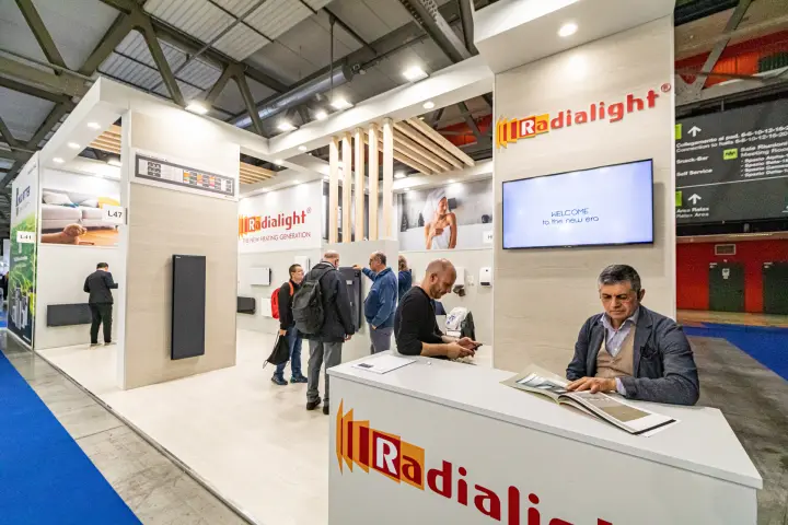 Radialight stand with welcome screen and wooden slat ceiling