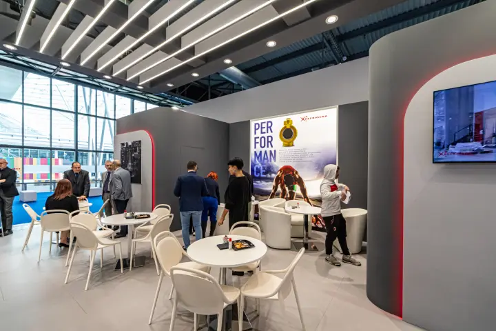 Refrigera lounge with PERFORMANCE poster and wall screen at MCE 2024