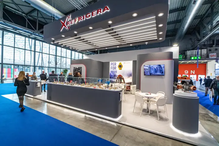 Refrigera stand with backlit canopy logo and valve display counter at MCE 2024
