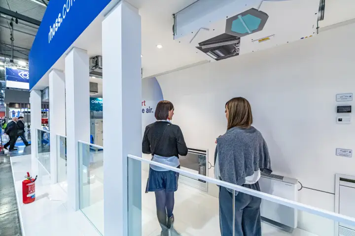 Rhoss ceiling unit underside and wall controllers above floor fan coils at MCE 2024