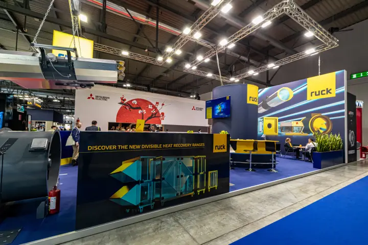 Ruck stand promoting new divisible heat recovery ranges on a dark blue wall