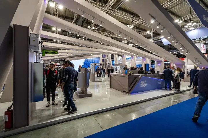 Sabiana reception counter and wall-mounted units under angled grey beams at MCE 2024