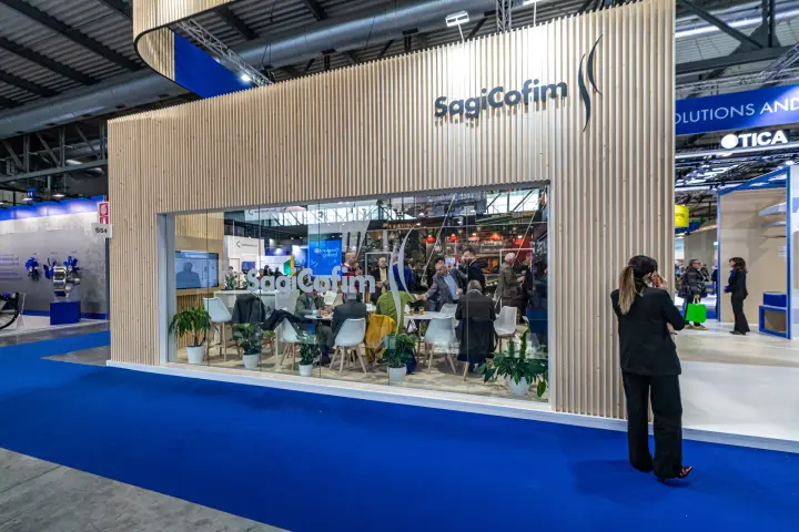 SagiCofim glass-fronted meeting lounge in a slatted wood pavilion at MCE 2024