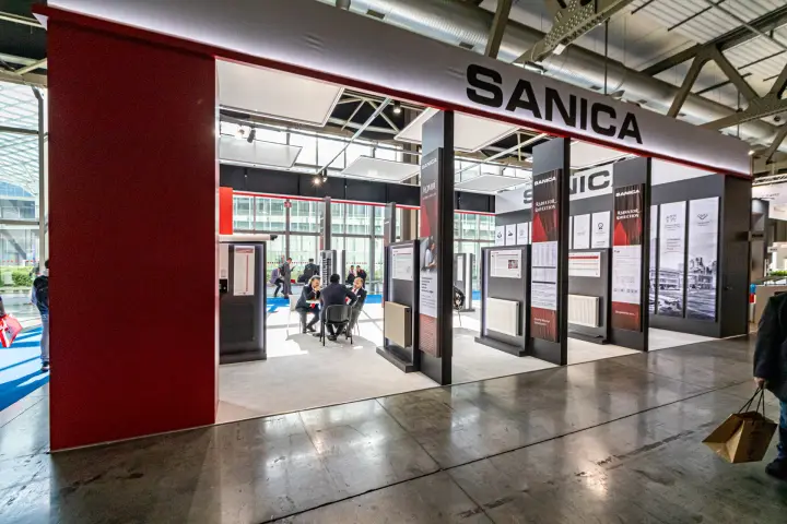 Sanica stand front with large fascia and radiator collection columns