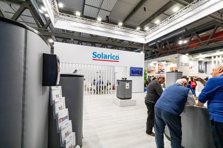 Solarico stand seen past a large insulated tank and brochure rack