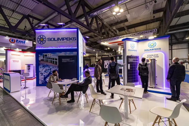 Solimpeks meeting area with stainless steel tank and PV panel at MCE 2024