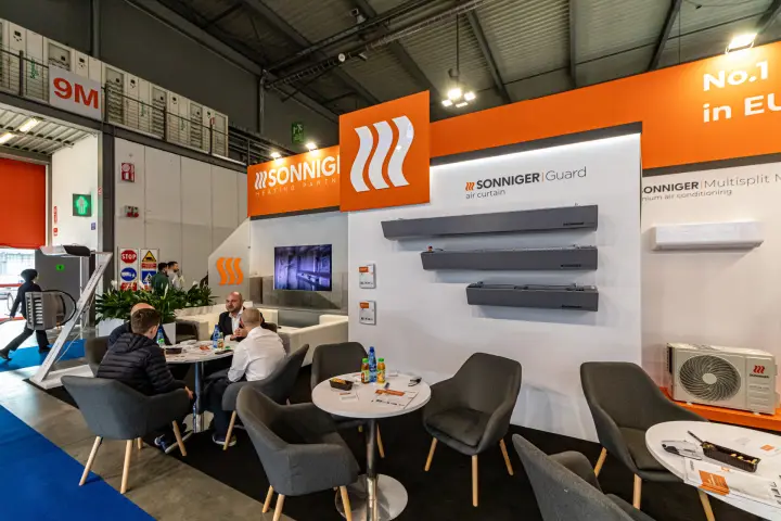 Sonniger stand with Guard air curtains and seating area at MCE 2024