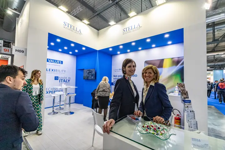 Staff at the glass counter of the Stella Welding Alloys stand