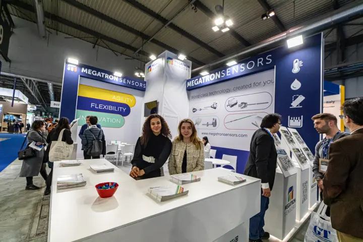 Staff at the Megatron Sensors counter with brochures and sensor displays at MCE 2024