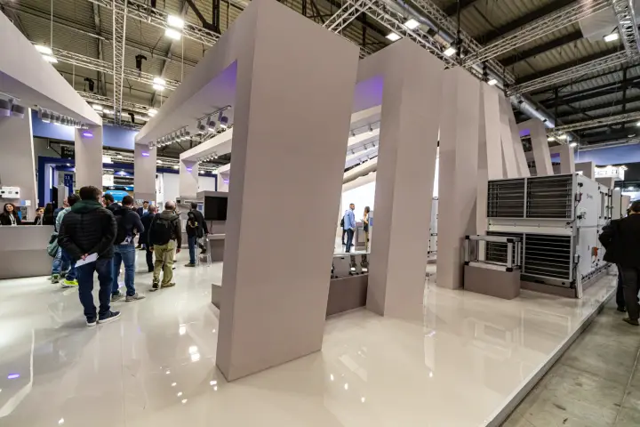 Stand with slanted pale-grey portals and an air handling unit