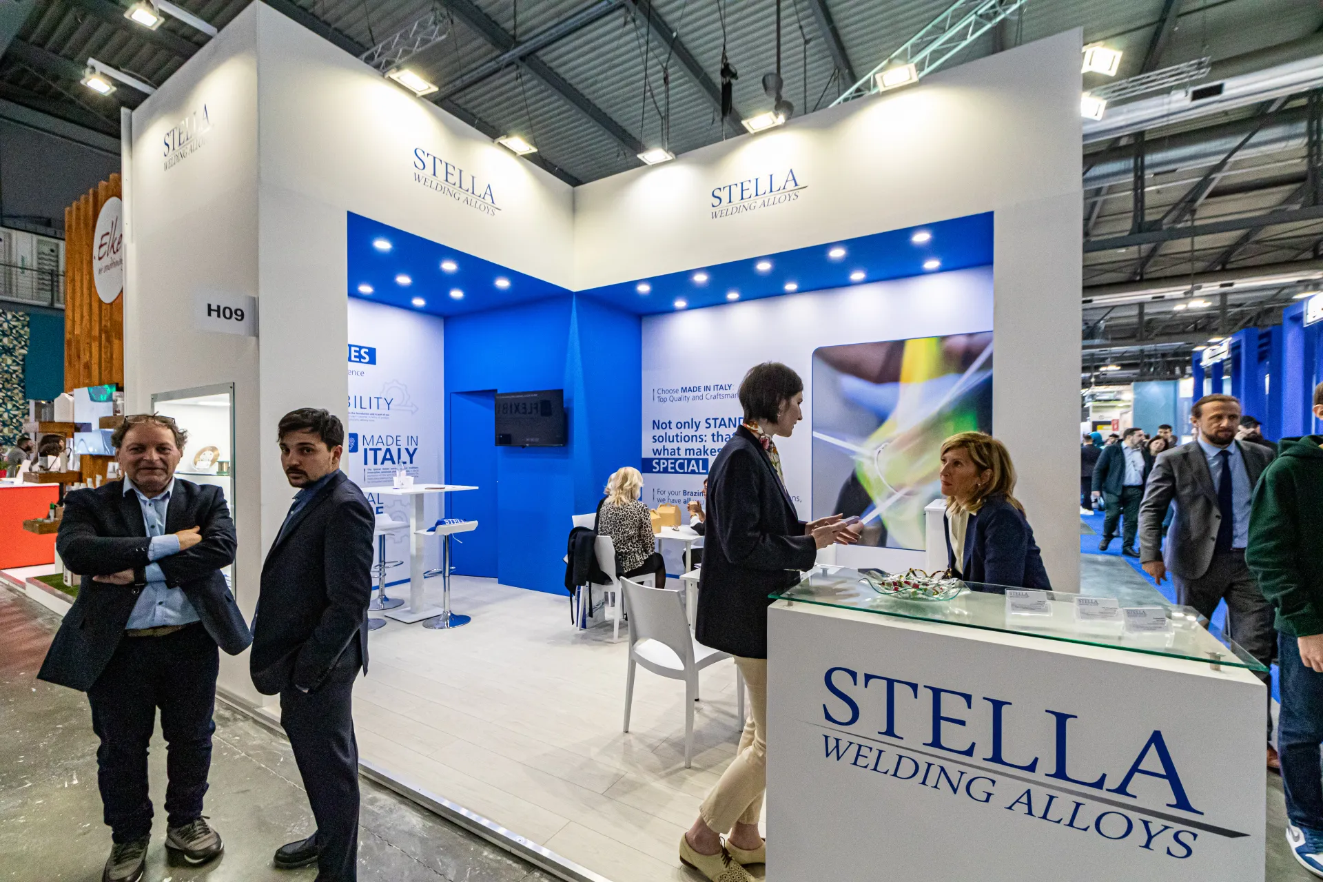 Stella Welding Alloys stand with blue-lit interior and branded counter at MCE 2024