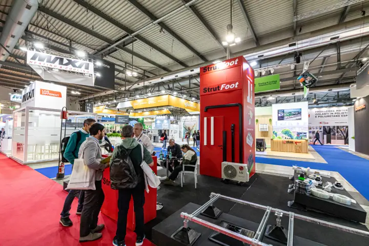 StrutFoot stand with red display tower and rooftop support frames at MCE 2024