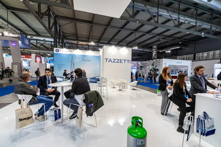 Tazzetti stand with refrigerant cylinder and sailing graphic at MCE 2024