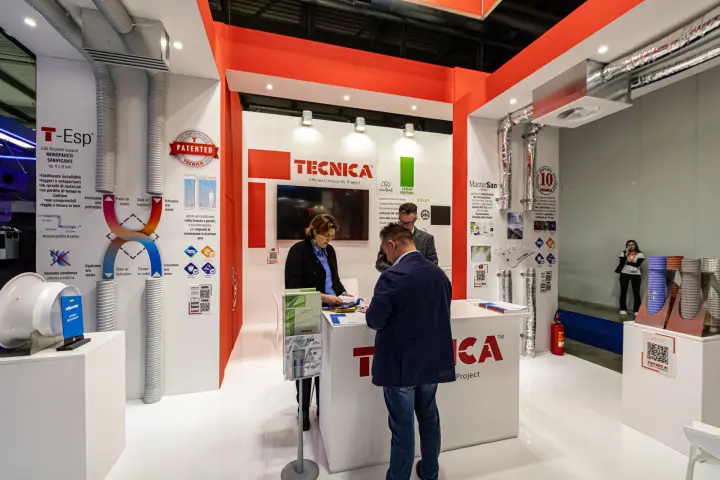 Tecnica reception counter with 'Patented' T-Esp ducts and MasterSan panel at MCE 2024