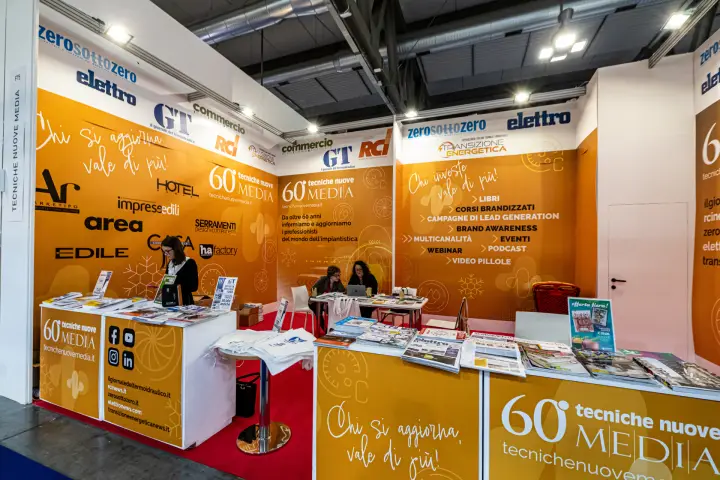 Tecniche Nuove Media stand with trade magazine titles and service list