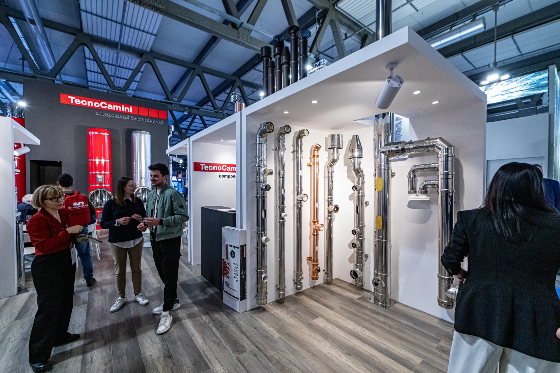 TecnoCamini stainless and copper flue systems in a house-shaped display at MCE 2024