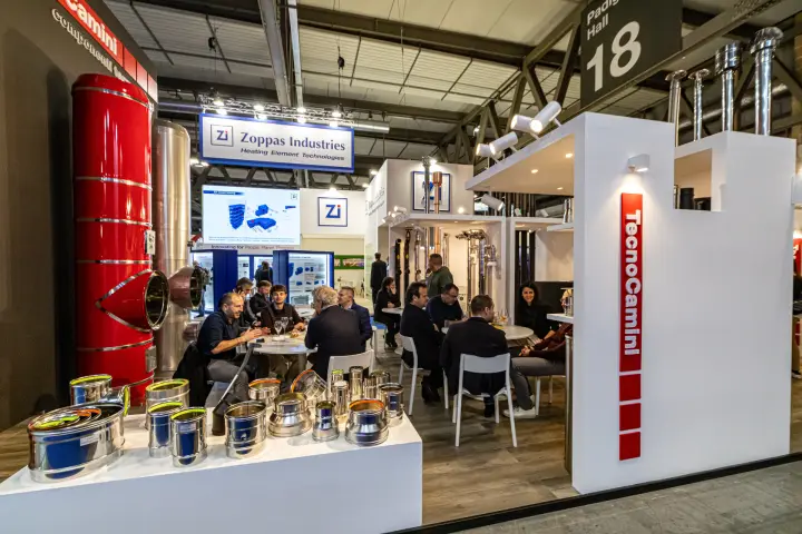 TecnoCamini stainless flue fittings and busy meeting area