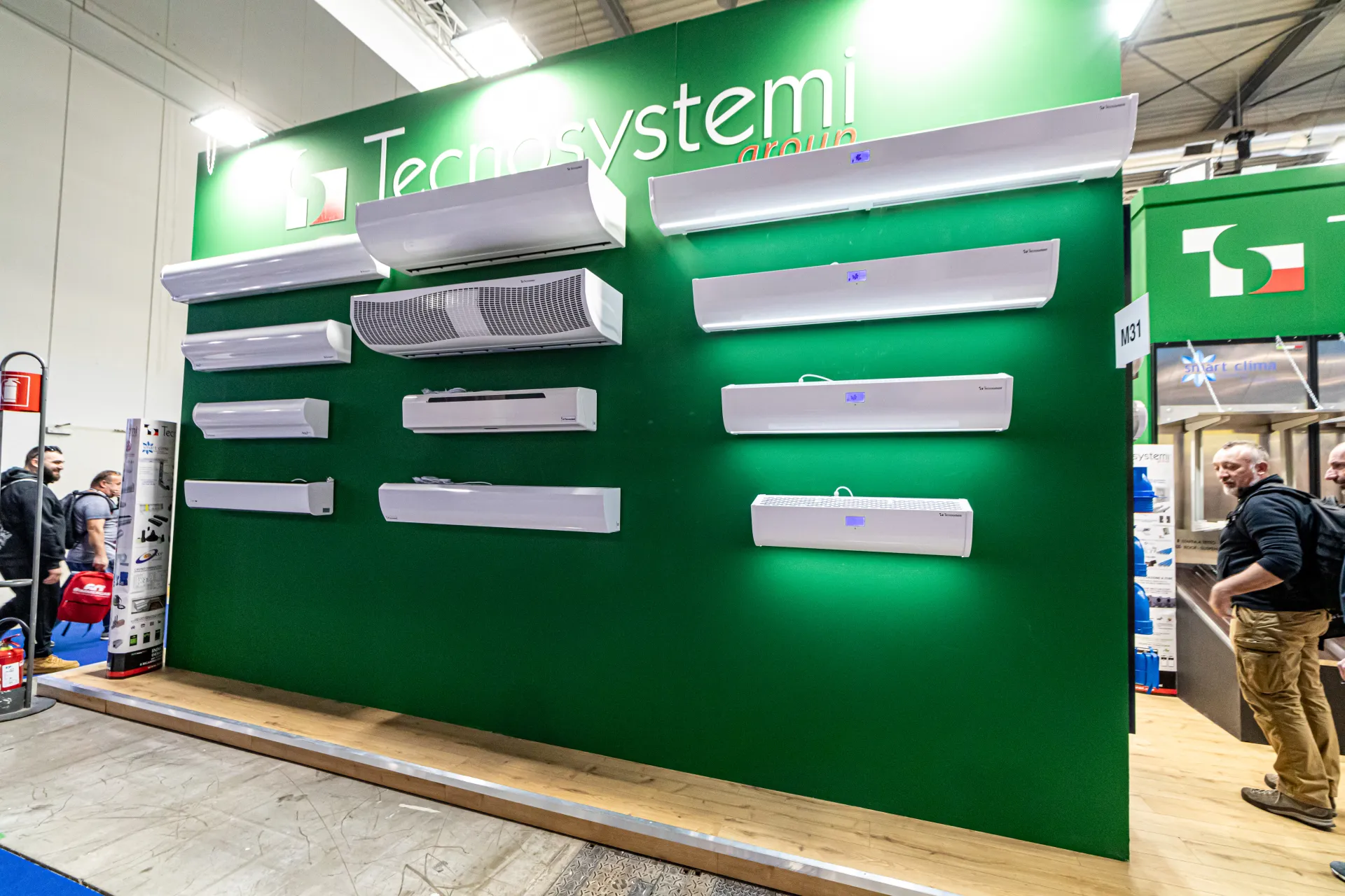 Tecnosystemi green wall lined with white air curtain units at MCE 2024