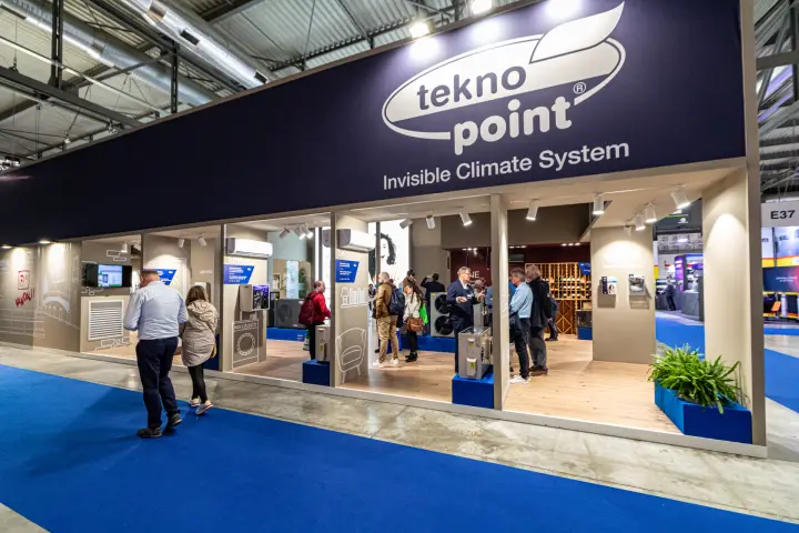 Tekno Point stand 'Invisible Climate System' with visitors among product bays at MCE 2024