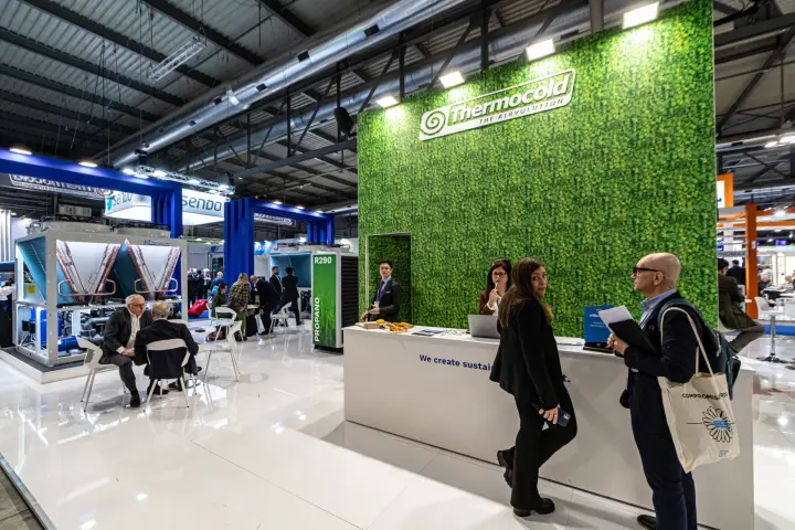 Thermocold reception desk under 'The Airvolution' green wall