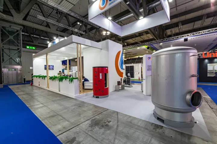 TML stand with a large steel buffer tank and red MAXIWARM cylinder at MCE 2024