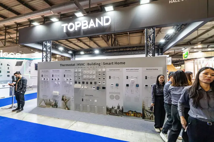 Topband booth L12 with a wall of heating and heat pump controls