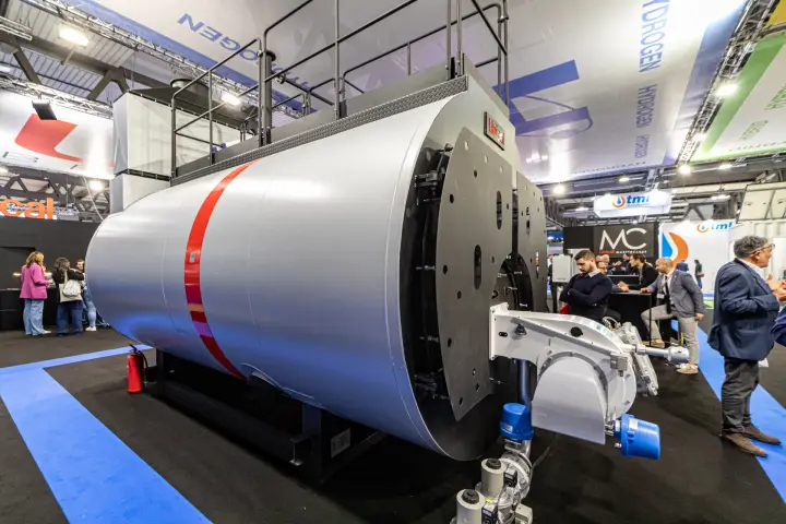 Unical industrial boiler with red stripe, burner and service platform