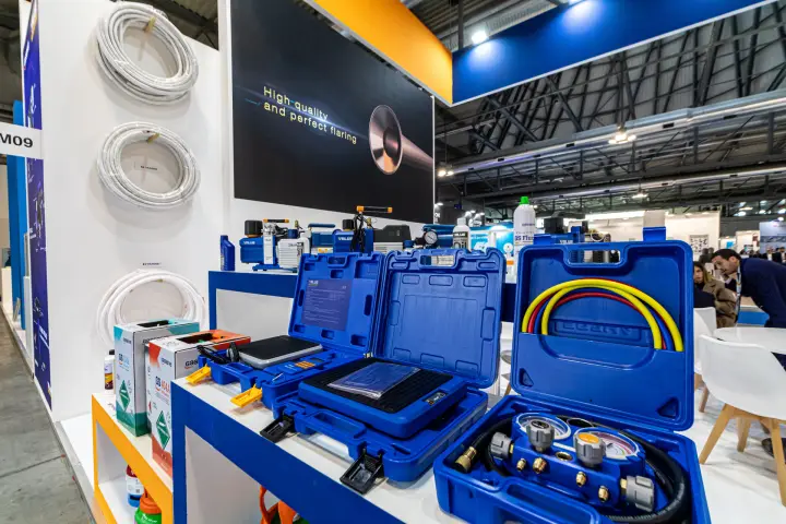 Value refrigerant scales and manifold gauge set in blue carry cases at MCE 2024