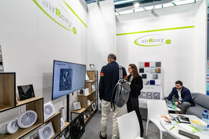 Visitors at the airRoxy screen showing the aRok industrial fan at MCE 2024