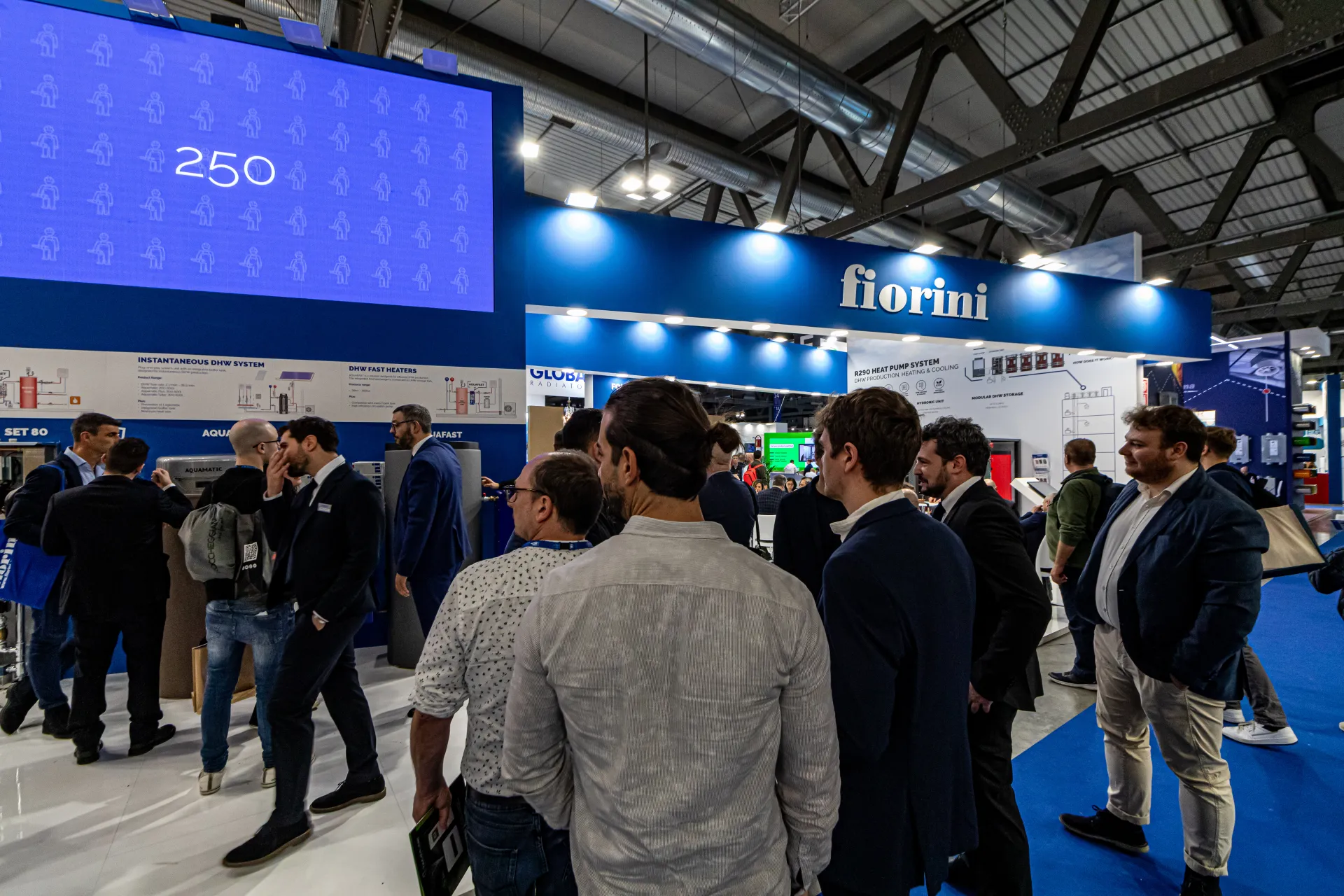 Visitors crowd the Fiorini stand beneath a large LED wall at MCE 2024