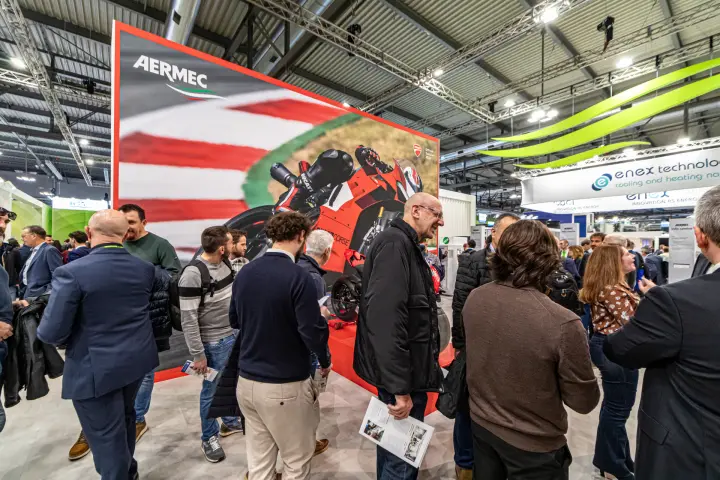 Visitors crowding the Aermec stand's Ducati Corse graphic wall at MCE 2024