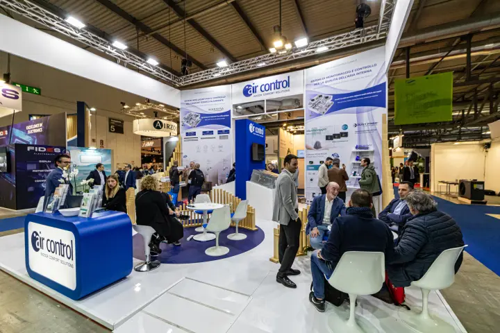Visitors meeting at the Air Control stand's lounge tables at MCE 2024