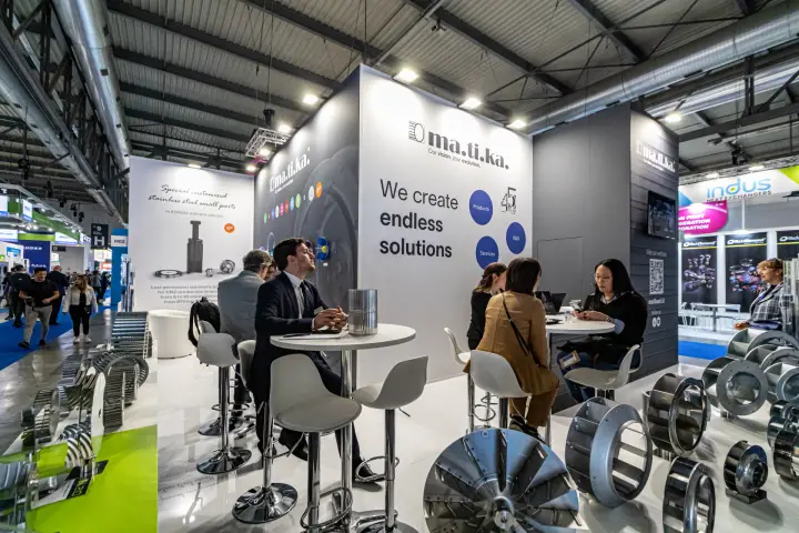 Wider view of the Matika stand with impeller displays and high tables at MCE 2024
