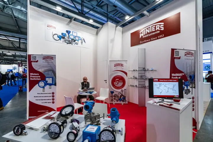 Winters Instruments stand with pressure gauges and blue transmitters on display at MCE 2024