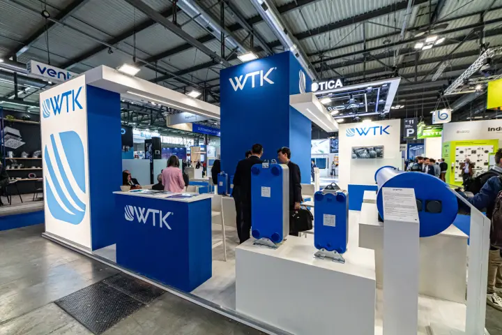 WTK stand with blue plate heat exchangers and a large cylindrical unit at MCE 2024